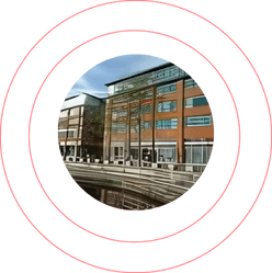 Building exterior framed within a bold red circular design
