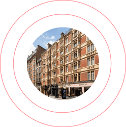 Historic multi-storey building with a red brick facade